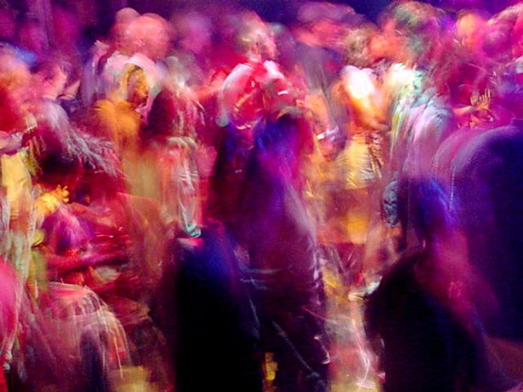 Dancing people at rave